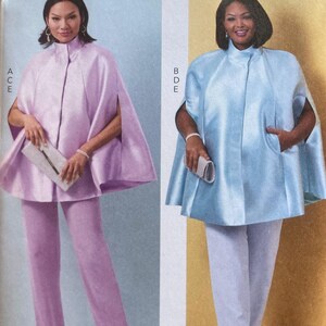 May include: A sewing pattern from Butterick features two women modeling capes and pants. One woman wears a light purple cape and pants, the other a light blue cape and white pants. The pattern number is B6978.