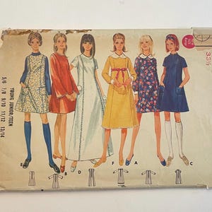May include: A vintage sewing pattern envelope with illustrations of young women in dresses. The envelope is aged, with the text "YOUNG JUNIOR/TEEN" and "ITERICK 4987" visible. The dresses include a floral print, a yellow dress, and a navy blue dress.
