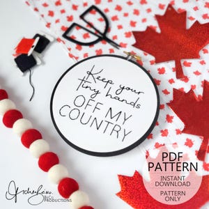 May include: A black and white embroidery hoop with the text "Keep your tiny hands off my country". The hoop is surrounded by red maple leaf shapes on a white background. The text "PDF PATTERN INSTANT DOWNLOAD PATTERN ONLY" is also visible.