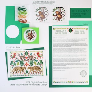 May include: A DIY cross-stitch kit featuring a monkey pattern, Aida cloth, embroidery threads in green and brown, a paper frame, a 5-inch by 7-inch art print with a jungle motif, and a July 2026 Thread & Paper Mail Club newsletter.