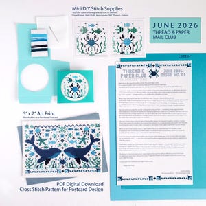 May include: A June 2026 Thread & Paper Mail Club kit featuring a mini DIY stitch supply set with Aida cloth, needle, and blue threads, a crab cross-stitch pattern, a 5" x 7" whale art print postcard, and an informational letter on white paper.