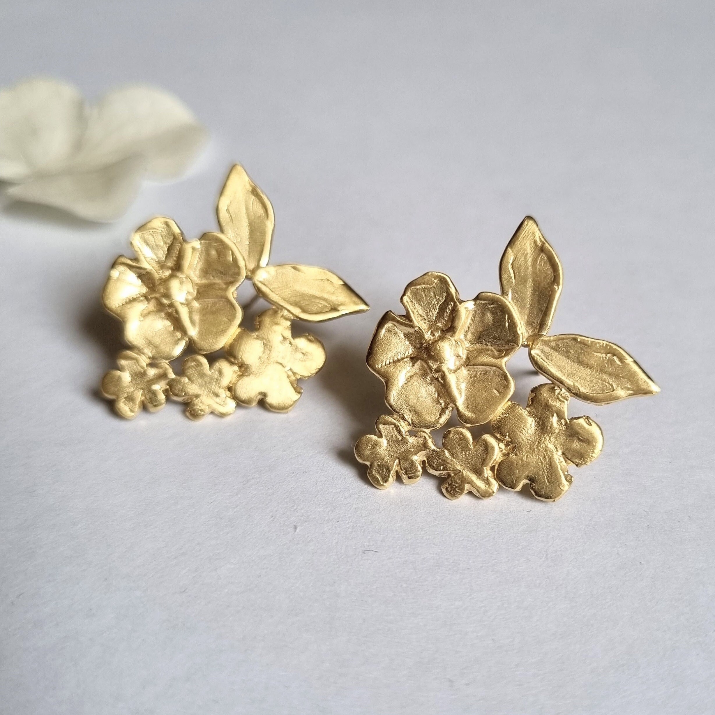 Gold flower statement earrings new arrivals