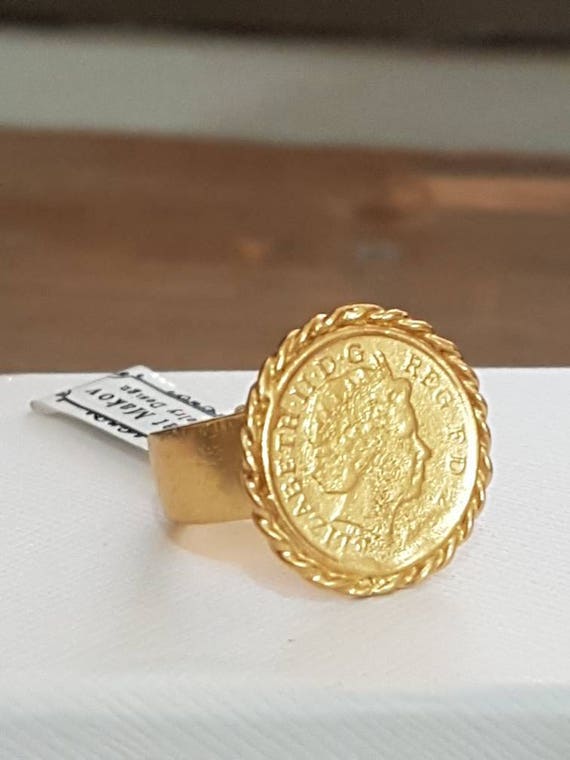 A regular gold coin ring is ornamented with diamonds. Its fine  craftsmanship and the art of fine jewellery a… | Gold coin jewelry, Gold  coin ring, Gold ring designs