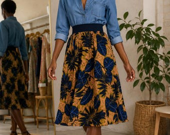 High-waisted midi skirt in a colorful, exotic African wax print. Women's summer skirt. Wide waistband and gathers. Made in France.