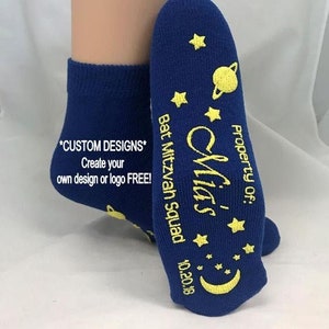 May include: Blue ankle socks with a yellow star and planet design. The socks say "Property of: Mia's Bat Mitzvah Squad 10.20.18" and "*CUSTOM DESIGNS* Create your own design or logo FREE!"