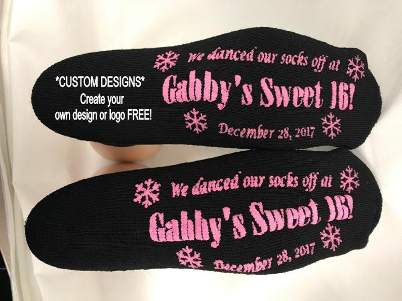 Puede incluir: Un par de calcetines negros con texto rosa que dice "We danced our socks off at Gabby's Sweet 16! December 28, 2017".