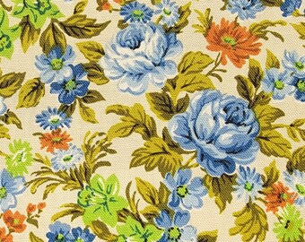 May include: A vintage floral fabric with a white background and a repeating pattern of blue and green flowers. The flowers are stylized and have a retro look.