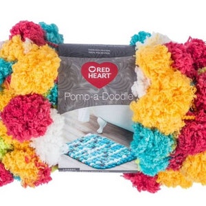 May include: A skein of Red Heart Pomp-a-Doodle yarn in a multi-colored pom-pom style. The yarn is in shades of yellow, red, white, blue, and green.
