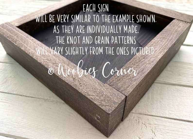 May include: A wooden sign with the text "EACH SIGN WILL BE VERY SIMILAR TO THE EXAMPLE SHOWN. AS THEY ARE INDIVIDUALLY MADE. THE KNOT AND GRAIN PATTERNS WILL VARY SLIGHTLY FROM THE ONES PICTURED &copy; Woobies Corner"