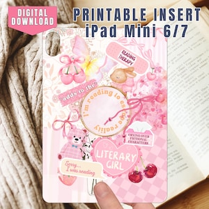 May include: A pink and white printable iPad Mini 6/7 insert with a floral and sticker design. The design includes a teddy bear, bunny, cherries, and text that reads "Literary Girl" and "Reading Therapy". The words "Digital Download" are also visible.