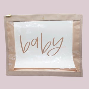 Clear vinyl Baby Pouch with beige leatherette and zipper enclosure.