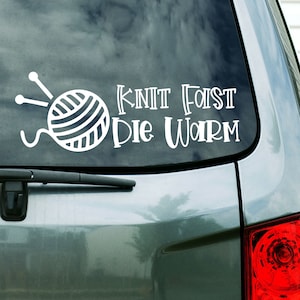 May include: A white vinyl car sticker with a yarn ball and knitting needles, and the text "Knit Fast Die Warm".