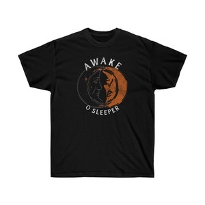 May include: Black t-shirt with a vintage-style graphic of a crescent moon with a face and the text "AWAKE O SLEEPER".