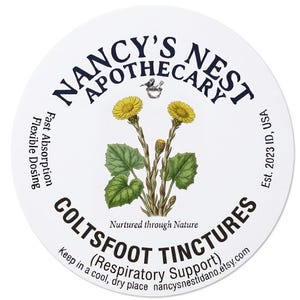 May include: A circular white label for Nancy's Nest Apothecary Coltsfoot Tinctures. It features a botanical illustration of yellow coltsfoot flowers, text reading Nurtured through Nature, Fast Absorption, Flexible Dosing, and Est. 2023 ID, USA.