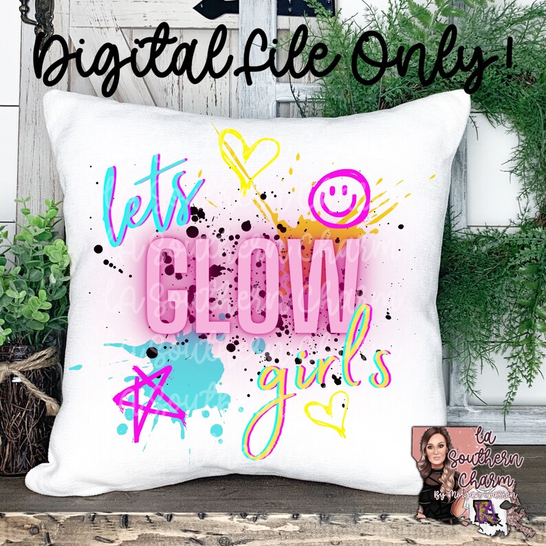 May include: White pillow with a colorful design that says "Let's Glow Girls" with paint splatters and stars.
