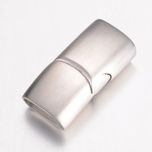 May include: Silver-toned metal magnetic clasp for jewelry making. The clasp is rectangular and has a brushed finish.