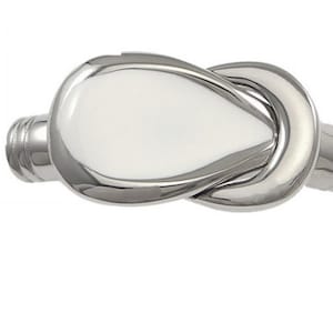 May include: A silver knot-shaped bracelet with a smooth, polished finish.