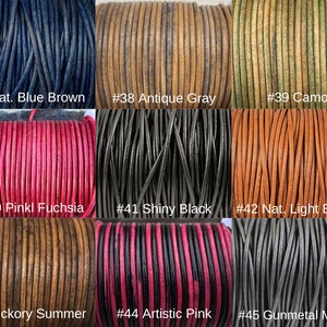 May include: Close-up of ten spools of leather cord in various colors, including natural blue brown, antique gray, camo, pink fuchsia, shiny black, natural light brown, hickory summer, artistic pink, and gunmetal metallic. Each spool is labeled with a number.