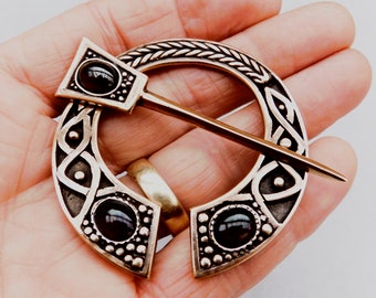 Cloak Clasp - Pennanular Brooch with Garnet