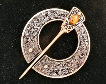 Cloak Clasp - Zoomorphic  Pennanular Brooch with Baltic Amber