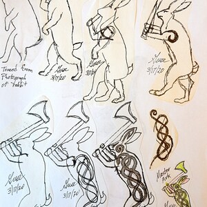 Master Ark's original design work showing the evolution of the design for the axe wielding rabbit.  All designs are signed Guse with date 3/17/20.  Final copyrighted design signed Guse 3/17/20, Master Ark