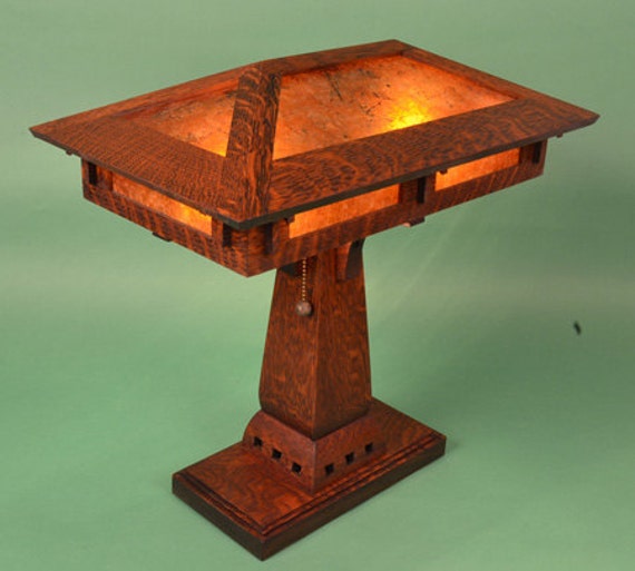 The lamp comes standard with round brass pull chain ends. arts and crafts mission style oak and mica desk lamp