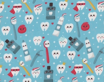 May include: A blue fabric with a repeating pattern of white teeth, toothbrushes, toothpaste tubes, mouthwash bottles, and red hearts. The teeth have cartoon faces and some are wearing crowns or capes. The fabric has a white ruler with black markings at the bottom.