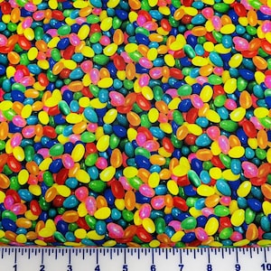 May include: A colorful fabric with a jelly bean pattern. The fabric is covered in a variety of colors, including red, orange, yellow, green, blue, purple, and pink.