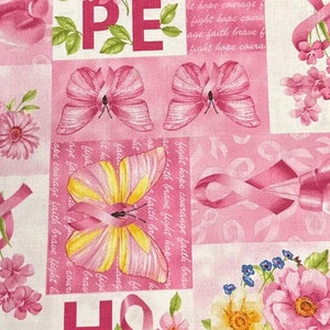 May include: Pink fabric with a repeating pattern of butterflies, flowers, and pink ribbons. The fabric has the words "Hope", "Courage", "Faith", "Brave", and "Fight" repeated throughout the pattern.