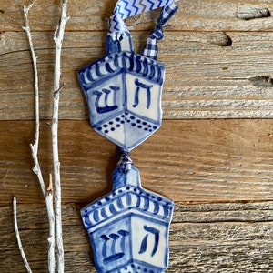 One dreidel ornament. Blue and white delftware ornament. Handmade porcelain hanging dreidel. USA image 1