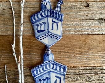 One dreidel ornament. Blue and white delftware  ornament. Handmade porcelain hanging dreidel. USA