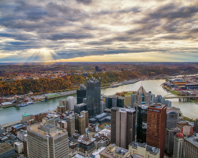 The sun breaks through the clouds during a fall sunset in Pittsburgh - Metal Print