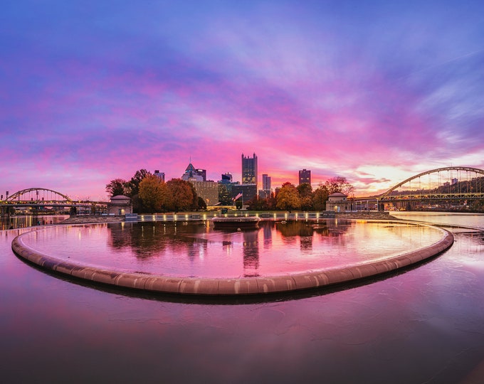 A fire in the sky reflects in the icy Pittsburgh fountain - Various Prints