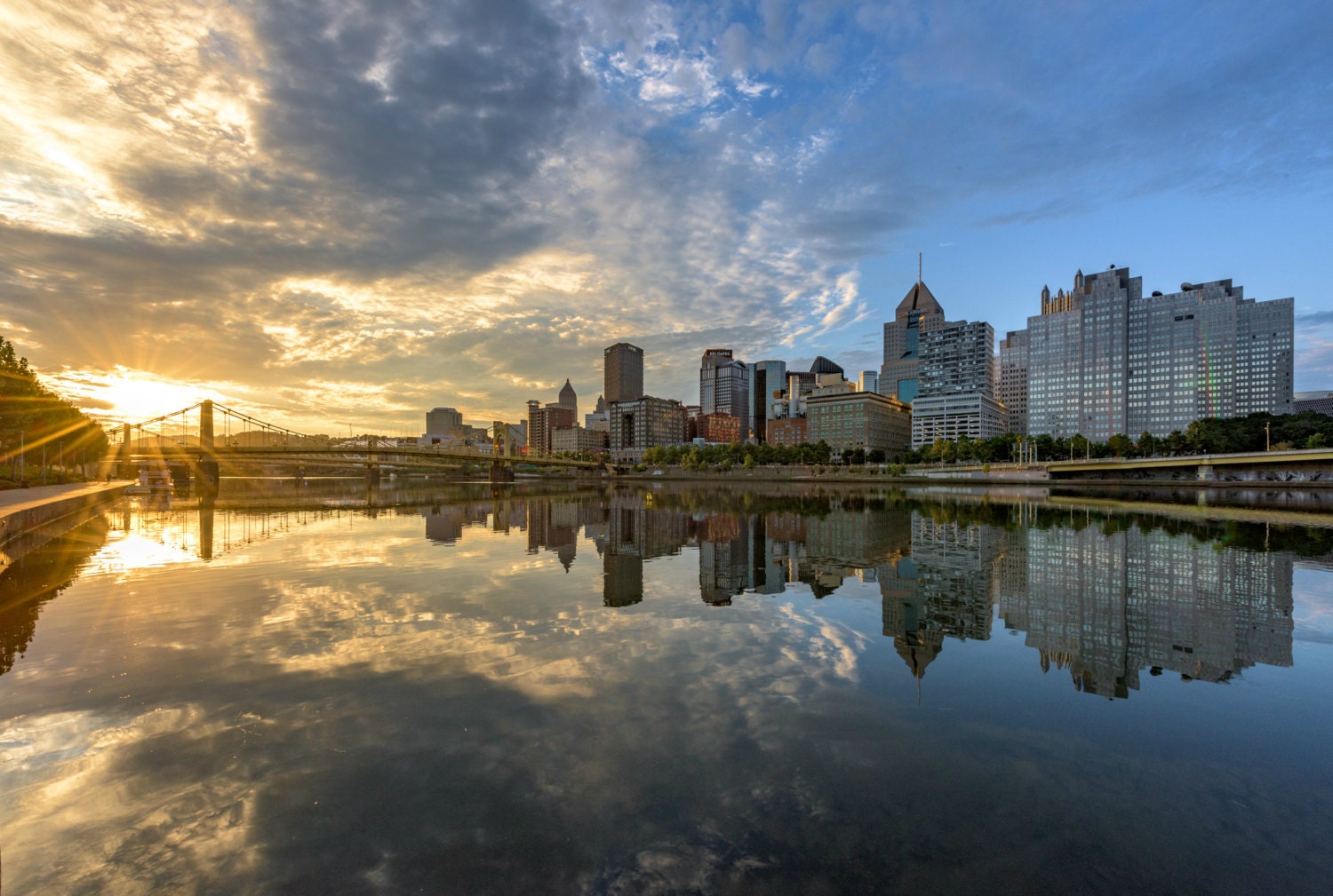 A beautiful sunrise reflects in the Allegheny River in Pittsburgh