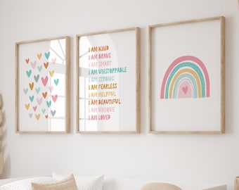 May include: Three framed prints with a colorful rainbow, a collection of hearts, and a list of positive affirmations. The text on the print reads: "I am kind, I am brave, I am smart, I am unstoppable, I am strong, I am fearless, I am helpful, I am beautiful, I am unique, I am loved."