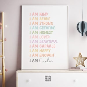 May include: A printable poster with the text "I am" followed by a list of positive affirmations in rainbow colors, ending with "I am Emilia".