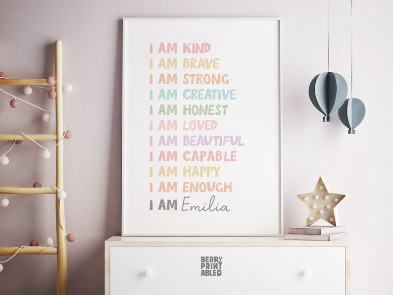 May include: A printable poster with the text "I am" followed by a list of positive affirmations in rainbow colors, ending with "I am Emilia".