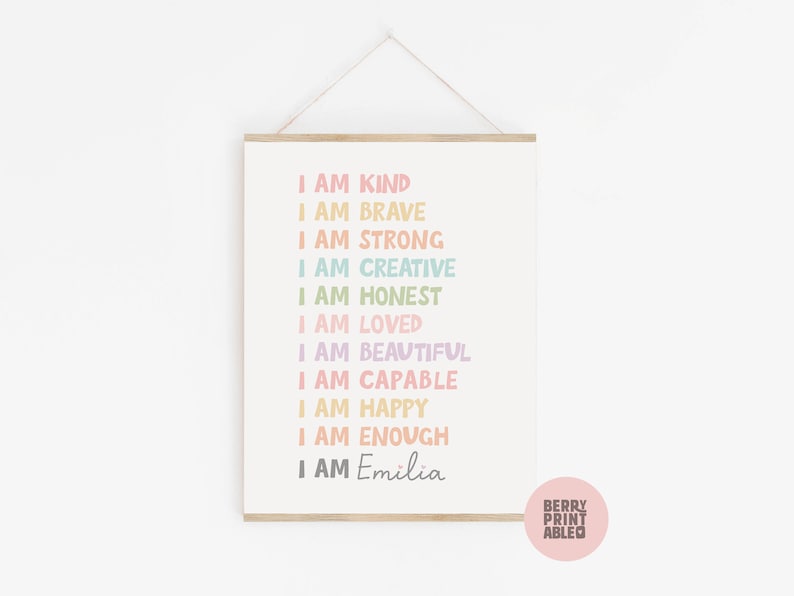 May include: A printable wall art design with the text "I am kind, I am brave, I am strong, I am creative, I am honest, I am loved, I am beautiful, I am capable, I am happy, I am enough, I am Emilia". The text is in a rainbow of colors and is printed on a white background.