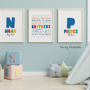 May include: Two colorful printable posters with the names Noah and Pierce, each with a large letter N and P, and a list of words describing brothers. The posters are framed in wood and have a white background.