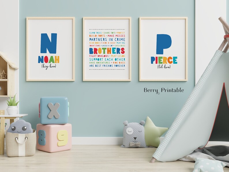 May include: Two colorful printable posters with the names Noah and Pierce, each with a large letter N and P, and a list of words describing brothers. The posters are framed in wood and have a white background.