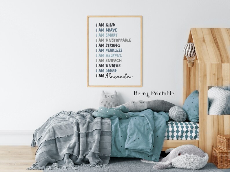 May include: A framed printable with a blue and gray color scheme. The text reads "I am kind, I am brave, I am smart, I am unstoppable, I am strong, I am fearless, I am helpful, I am enough, I am unique, I am loved, I am Alexander".