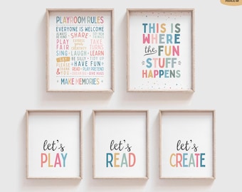 May include: Five framed wall art prints with light wood frames. The top left print lists playroom rules in colorful text. The top right print reads, This is where the fun stuff happens. The bottom three prints read, let's play, let's read, and let's create.