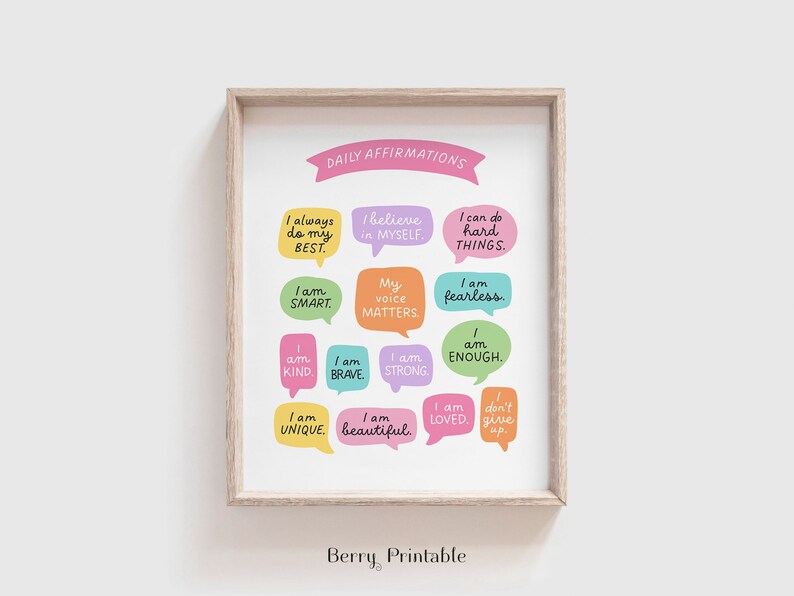 May include: A printable poster with the text "DAILY AFFIRMATIONS" in pink at the top. The poster features 12 colourful speech bubbles with positive affirmations, such as "I always do my best", "I believe in myself", "I am smart", "My voice matters", "I am fearless", "I am kind", "I am brave", "I am strong", "I am enough", "I am unique", "I am beautiful", and "I am loved". The poster is framed in a light wood frame.