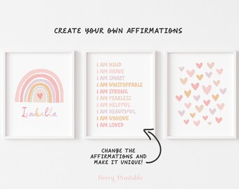 May include: Three framed prints with a white background. The left print features a rainbow with the name "Isabella". The center print lists affirmations like "I AM BRAVE". The right print displays heart shapes. Text reads "CREATE YOUR OWN AFFIRMATIONS".