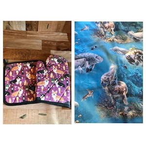 May include: A set of two purple oven mitts with a pattern of corgis and wine glasses. The mitts are on a wooden surface.