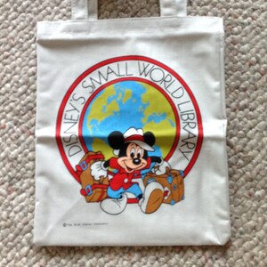 Bolsa de tela vintage de Disney para niños, mochila de Mickey Mouse, bolsa de lona de la biblioteca Disney Small World, mochila infantil para la vuelta al cole.