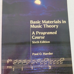 May include: A softcover textbook titled Basic Materials in Music Theory: A Programed Course, Sixth Edition by Paul O. Harder. The cover features a dark blue night scene with a bright moon over water and white musical staff lines at the bottom.