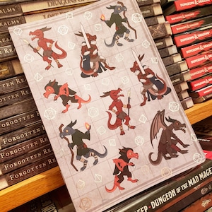 May include: A sheet of stickers featuring various red and black dragon characters with different poses and accessories. The stickers are on a white background with a grid pattern and white dice outlines.