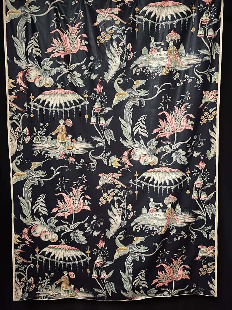 May include: Black fabric with a repeating pattern of pink and green flowers, birds, and people in a Chinese garden setting.
