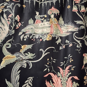 May include: Black fabric with a repeating pattern of stylized flowers, leaves, and a scene of two figures in a garden setting. The figures are wearing traditional clothing and are holding teacups.